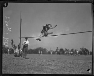 [Photograph: Elizabeth Stine, track athlete, engaged in high jump, circa 1922-1926]