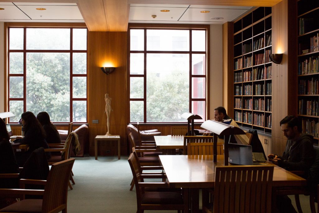 photograph of people at study tables inside the UCSF library